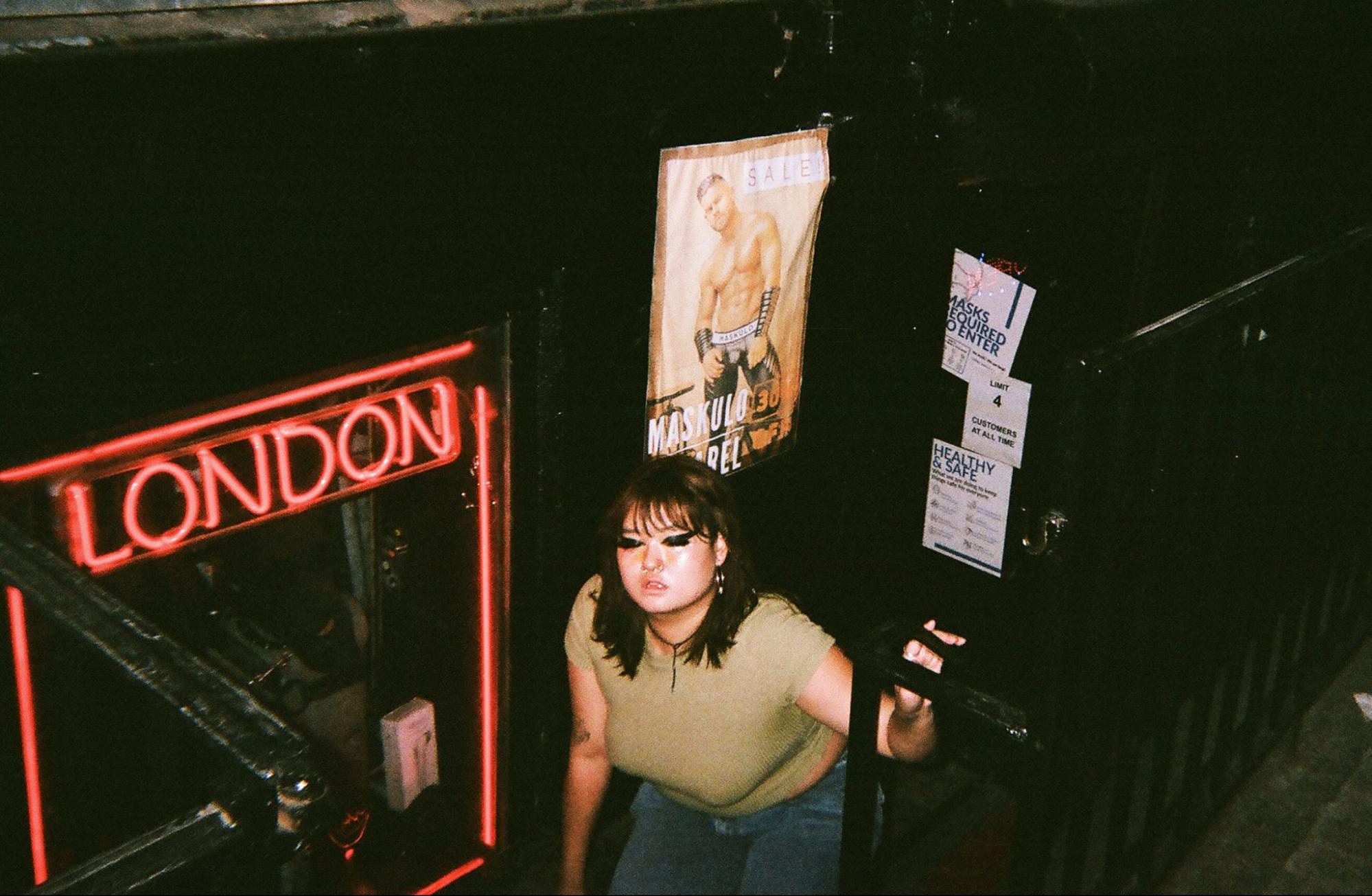 Margaret in the doorway of London, a sex shop in the West Village